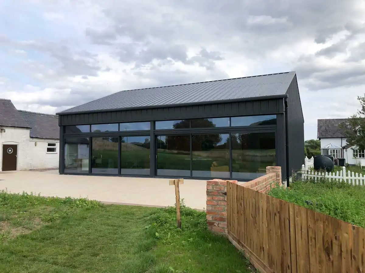A black home with aluminum windows.